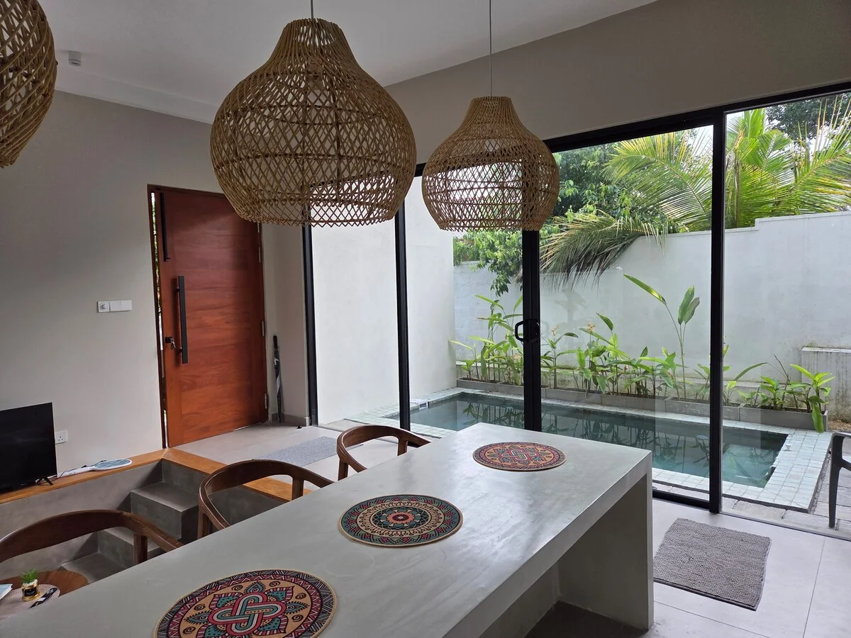 Dining and living area beside the private pool